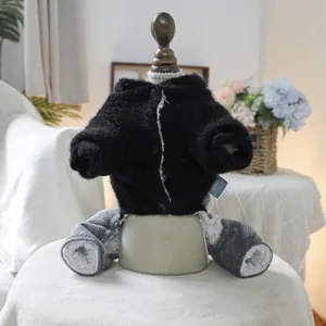 Detail of warm black plush pet jacket with gray plaid legs and soft faux lamb wool lining