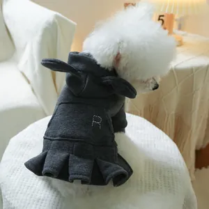 Close-up of a dark grey pet hoodie dress with rabbit ears and R embroidery on a dog