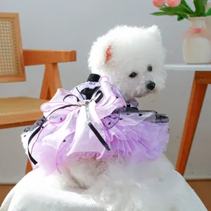 Detail of Halloween pet dress with purple tulle, black dots, and a large bow for small dogs