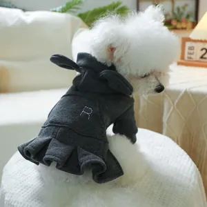 Close-up of dark grey dog hoodie dress featuring R embroidery and pleated hem detail