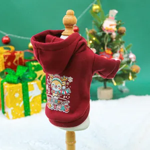 Detail of warm burgundy dog hoodie with reindeer print and Merry Christmas slogan