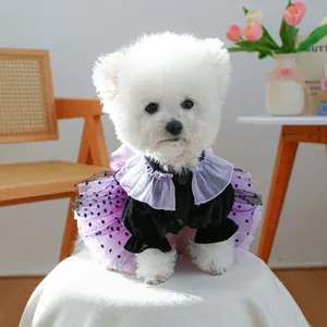 Detail of pet dress with black velvet bodice, purple tulle polka dot skirt and lace trim