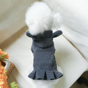 Detail of grey pet hoodie dress with white letter R embroidery and pleated skirt hem