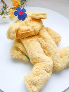 Detail of yellow plush pet jumpsuit showing fuzzy faux rabbit fur and flower ornament