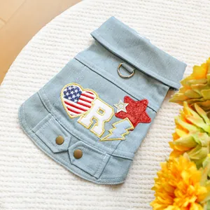 Detail of pet denim vest with American star patches, metal D-ring and sequin stars