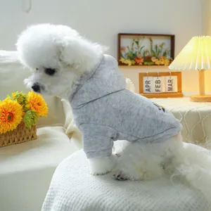 Detail of grey hooded pet sweatshirt with artistic back print on a white dog