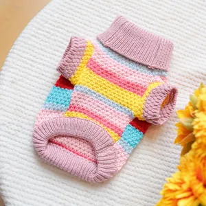 Close-up of colorful striped pet sweater with thick knit texture and ribbed turtleneck detail