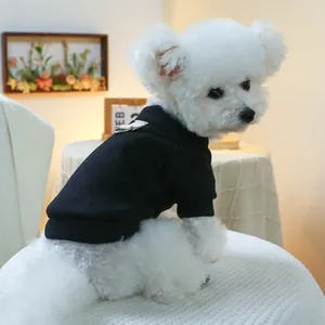 Detail of a black cotton dog hoodie with a metal D-ring for leash attachment