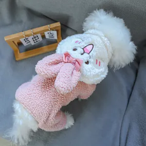 Detail of pink fleece dog jumpsuit with bunny ears hood and plush velvet bow decoration
