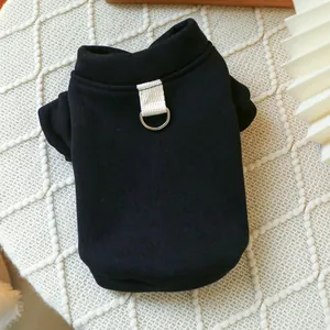 Detailed close-up of a black pet hoodie with metal D-ring for leash attachment