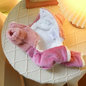 Detailed macro view of pink pet overall with warm fleece lining and snap button closure