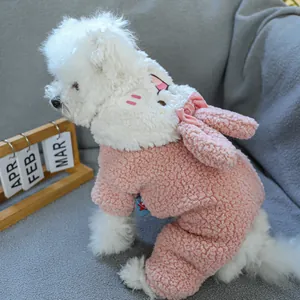 Detailed view of pink fleece pet jumpsuit with rabbit ears and plush texture for dogs
