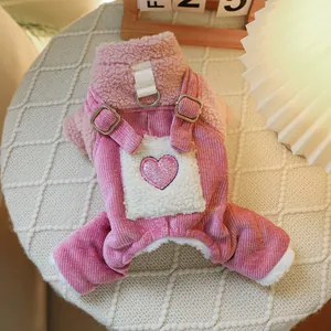 Detail of pink corduroy pet overalls with fleece pocket and heart sequin patch