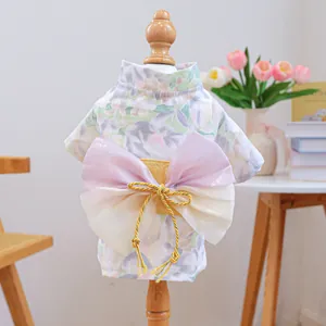 Floral pet kimono for small dogs and cats featuring a purple decorative bow on back