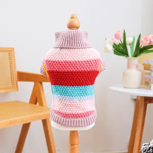 Colorful striped pet knit sweater for dogs and cats on a cozy indoor display