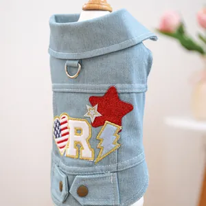 Blue denim pet vest featuring American star embroidery and a functional metal D-ring attachment
