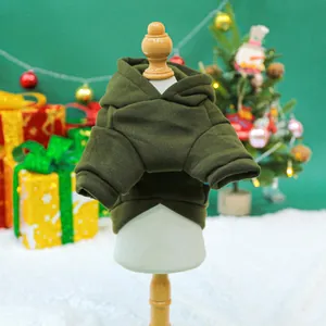 Detail of dark olive green pet hoodie on display with festive Christmas decor background