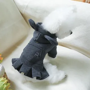 Detail of dark grey pet hoodie dress with white R embroidery and pleated skirt