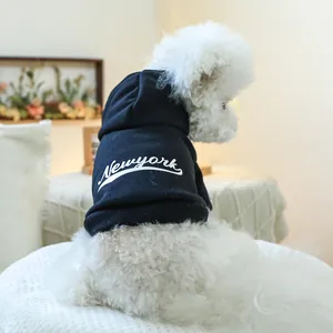 Close-up of a navy blue cotton hooded dog hoodie featuring a white NEWYORK print
