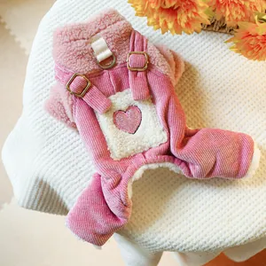 Detail of pink corduroy pet overalls with fleece lining and sequin heart patch