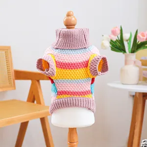 Detail of colorful striped pet sweater with thick knit texture and turtleneck design