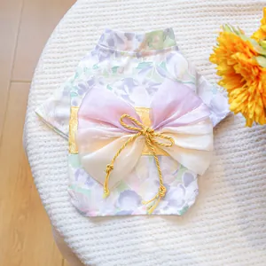 Detail of lavender floral pet kimono featuring a large organza bow and golden decorative knot