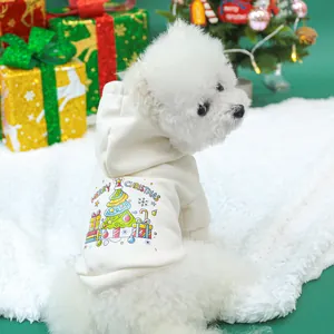 Close-up of a cream pet hoodie with a Christmas tree print and Merry Christmas text