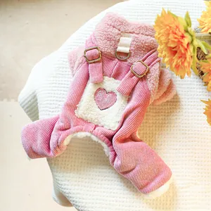 Detailed view of pink corduroy dog overall with warm sherpa lining and metal D-ring buckle