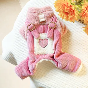 Detail of pink pet jumpsuit featuring heart patch, velvet fleece and corduroy textures
