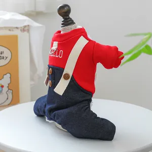 Detail of red and blue pet jumpsuit with D-ring, lace collar, and HELLO embroidery