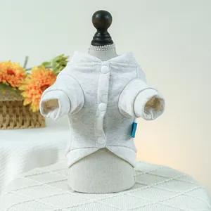Detail view of heather gray pet cardigan with white snap buttons on mini mannequin