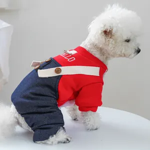 Detail of pet jumpsuit featuring red upper with HELLO embroidery and denim pants texture