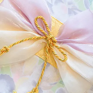 Exquisite floral kimono detail with organza ribbon bow and decorative cord for pets