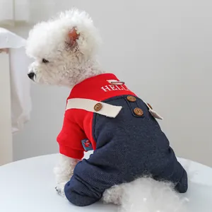 Detailed view of dog cotton jumpsuit featuring HELLO embroidery and metal D-ring attachment