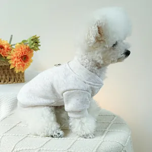 Detail of dog sweater with metal D-ring attachment for leash on a knitted cotton pet vest