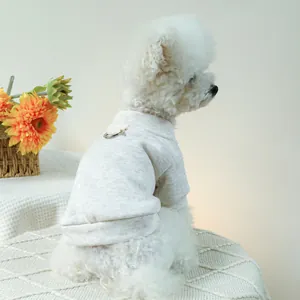 Minimalist oatmeal dog hoodie with metal D-ring for leash attachment on knit fabric