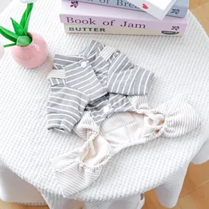Detail of grey striped dog overall featuring soft plush lining and ribbed cuffs