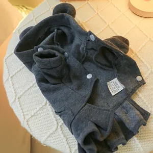 Detailed view of dark grey pet hoodie with bear ears and snap buttons on soft fabric