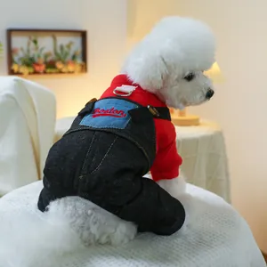 Close-up of pet jumpsuit featuring red hoodie with Boston embroidery and denim pants
