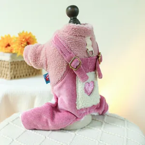 Detail of pink fleece pet overalls with sequined heart and metal buckles for small dogs