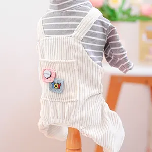Detail of pet grey striped shirt and cream corduroy overalls with cute embroidery