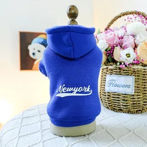 Detail of navy blue pet hoodie featuring white Newyork print and street style hood
