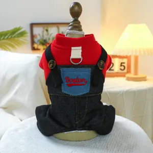 Detail of red knit sweater and denim overalls for dogs with Boston pocket and leash D-ring