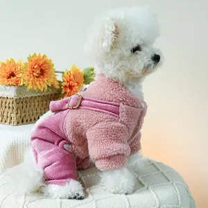 Close-up of pink fleece pet overall with gold buckles and corduroy pants for small dogs