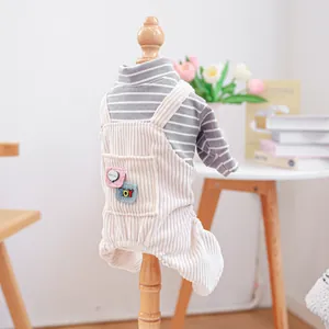 Detail of pet striped shirt and corduroy overalls with HELLO bubble embroidery