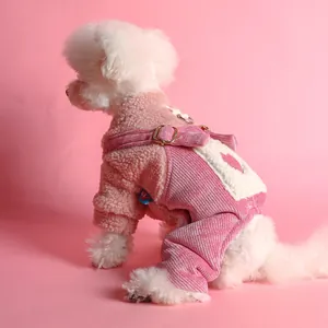 Pink fleece pet overalls for dogs and cats featuring heart pockets and D-ring harness