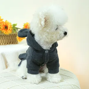 Dark grey hooded pet sweatshirt with cute ears and button closure on small white dog