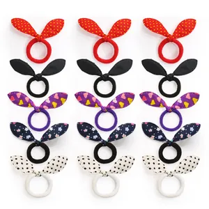 Close-up of 15pcs cute pet hair ties set with bunny ear bows in five assorted patterns
