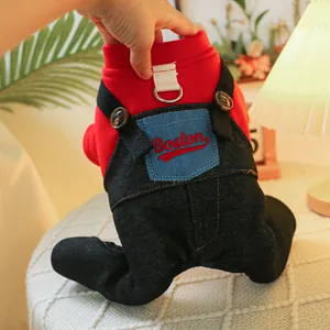 Detail of pet jumpsuit with D-ring, knit sweater top, and Boston embroidery denim pants