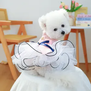 Detail view of pink pet princess dress with layered white mesh tutu and silk bow decoration